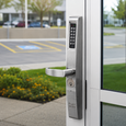 Adams Rite 3090 eForce keyless entry control installed on a commercial aluminum storefront glass door, Satin Chrome finish