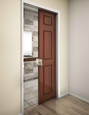 Trimco 1069L ADA Pocket Door Pull installed on a wood pocket door leading to a bathroom – in-use context showing wall frame integration
