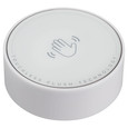 American Standard 7381981-201 touchless flush sensor, round white puck with hand-wave icon and Touchless Flush Technology label, top view