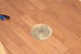 Arlington Industries TWO low openings with built-in divider, an ultra-thin stamped steel flange, and flush-to-the-floor in-use and blank covers. In a black powder-coated finish. Has an antique bronze plated finish.