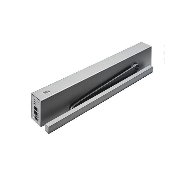 Dormakaba ED100LE Low Energy Swing Door Operator installed on single swing door in institutional corridor, shown with wall-mounted pushbutton actuator
