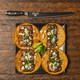 Kendrick BBQ scalloped brisket knife beside sliced brisket tacos