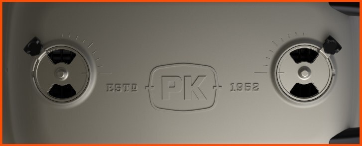 Close-up of a cast-aluminum PK Grill lid with radial vents and the PK logo marked Estd 1952