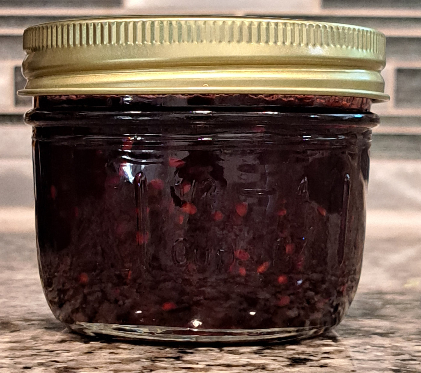 Jar of Small Batch TX blackberry jam made with crushed fruit