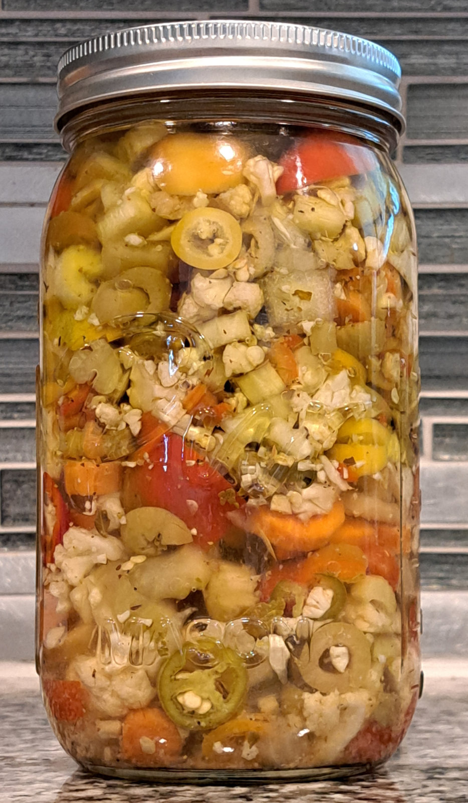 Jar of Small Batch TX Chicago giardiniera with chopped peppers and vegetables