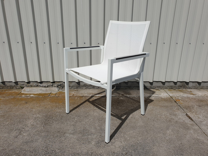 View of AMAKA dining arm chair in white with HPL - high pressure laminate armrests