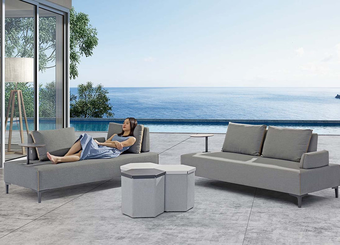 This picture shows 2 x Flexi outdoor multi functional sofas in anthracite finish, with different configurations of backrests, armrest and tray table. Hexagonal tables not included/available.