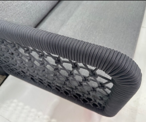 CLUB Right Arm sofa, close up picture of the outdoor rope woven over powdercoated aluminium frames, and Couturetex  grey  cushion colour, and dark grey rope