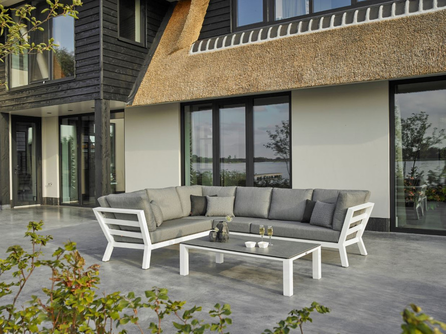 TIMBER Outdoor corner lounge set with high arm in white powder-coated aluminium frame. Cushions in picture are similar in look to actual cushions supplied by Poynters. But our cushions have been upgraded to premium Sunbrella Fabric in Natte grey.
There is also available, a single arm-less sofa to make the corner sofa longer, and arm chairs and 2.5 person sofa in the range. The CONCEPT coffee table as pictured  is available. We also have LEAF tables available.