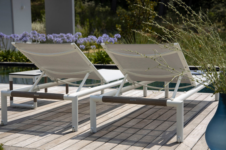 This image for illustrative purposes only. White frame version of Bastingage sun lounger shown.
Rear view of Bastingage batyline Eden mesh and aluminium frame sun lounger by les Jardins with teak accent