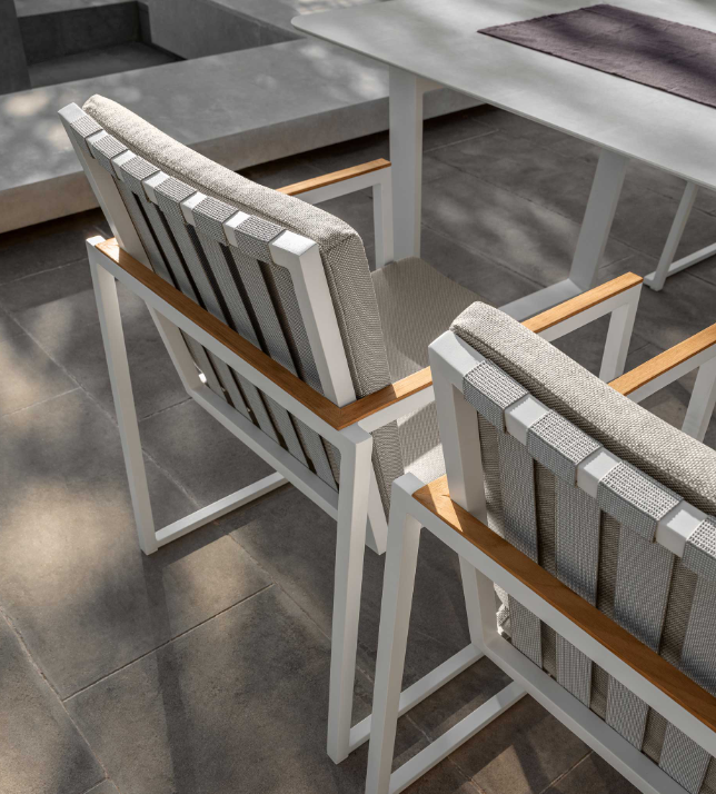 Alabama Dining chair with teak accent on the arms.  Supremely comfortable chair comes with outdoor squab.