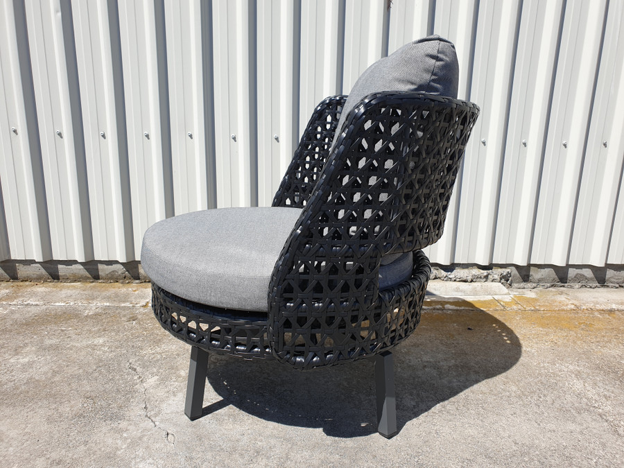 Side view of Tiki outdoor swivel chair. Powdercoated aluminium frame and black synthetic wicker