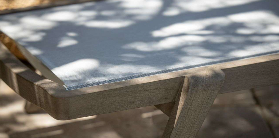 Close up view of COPENHAGUE outdoor sun lounger by Les Jardins. Finished with Duratek treated teak frame and premium Batyline Eden white fabric.