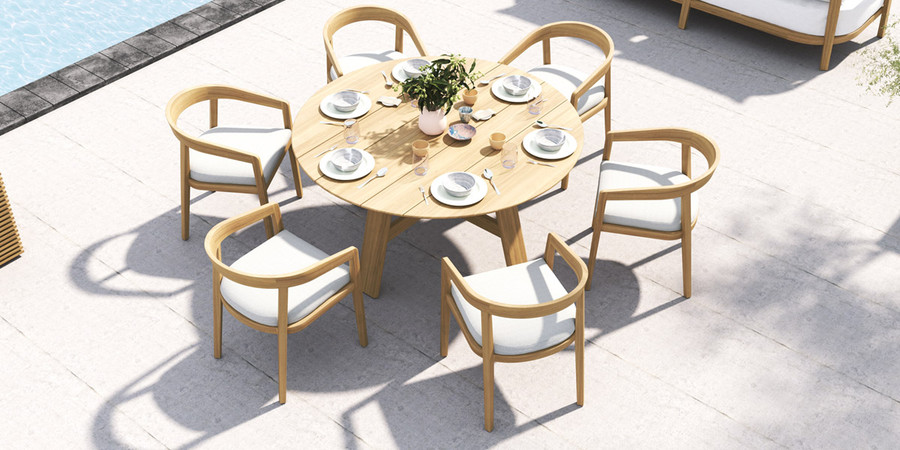 In situ view of Veneto outdoor dining chairs around an Octavia 1.6m diameter table.  This is supplied with Sunbrella Cast Grey cushion pad (differs from picture)