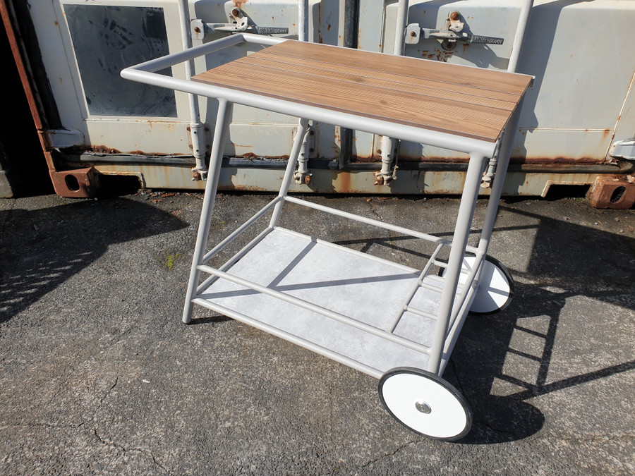 ZOOM outdoor trolley/cart on wheels - has a woodgrain HPL top and a faux marble ceramic coating base/shelf