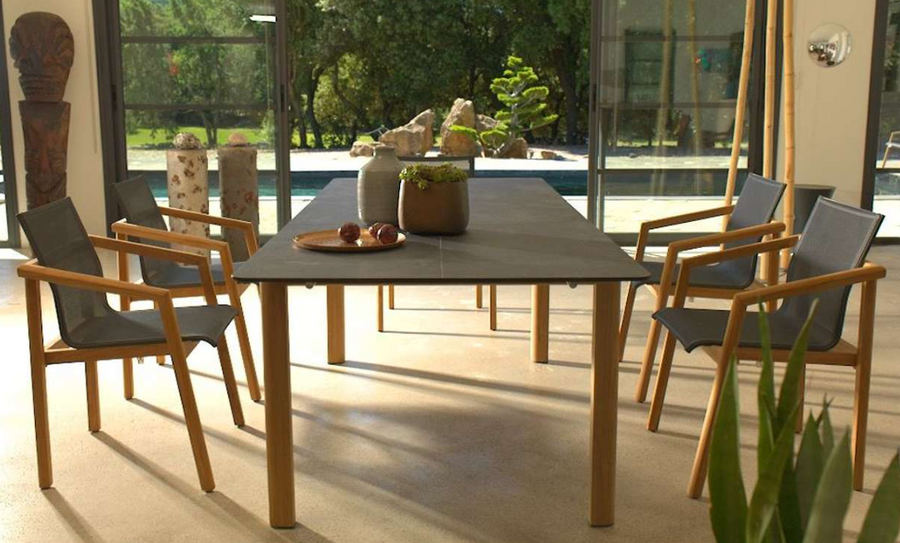 TEKURA table extended and displayed with matching TEKURA Dining Arm Chairs which are also available separately for purchase