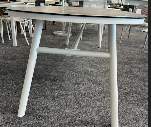 End view of Rio table, legs are set in from the edge