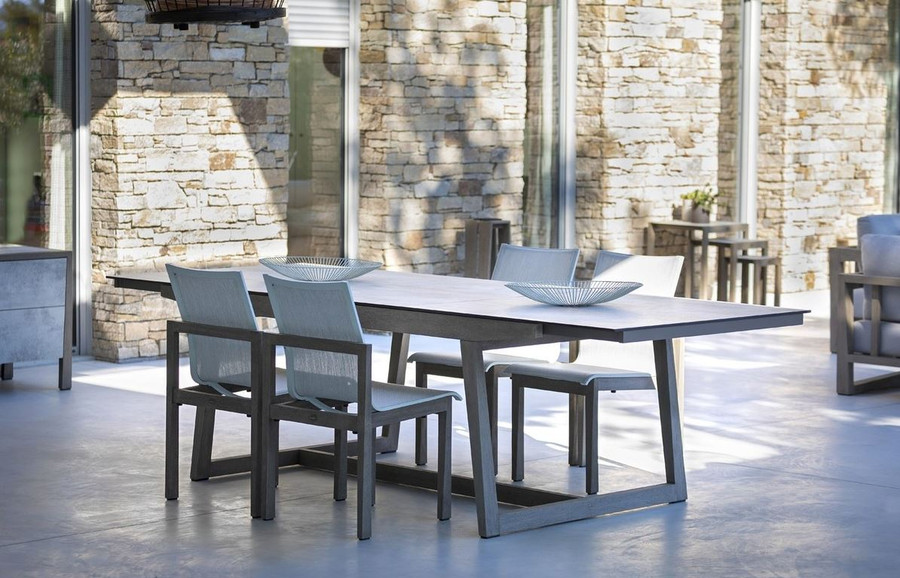 Les Jardins SKAAL outdoor teak table with HPL top fully extended with matching SKAAL dining side chairs with Batyline Eden mesh
Extends from 2m-2.7m