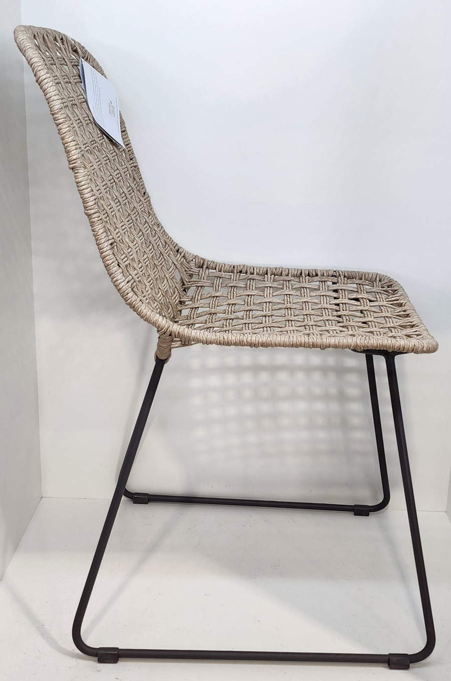 KAIA Dining side chair - white shell ecolene wicker on a coal hot dipped galvanised steel frame with sleigh legs - side view 
Also available in the matching KAIA dining armchair