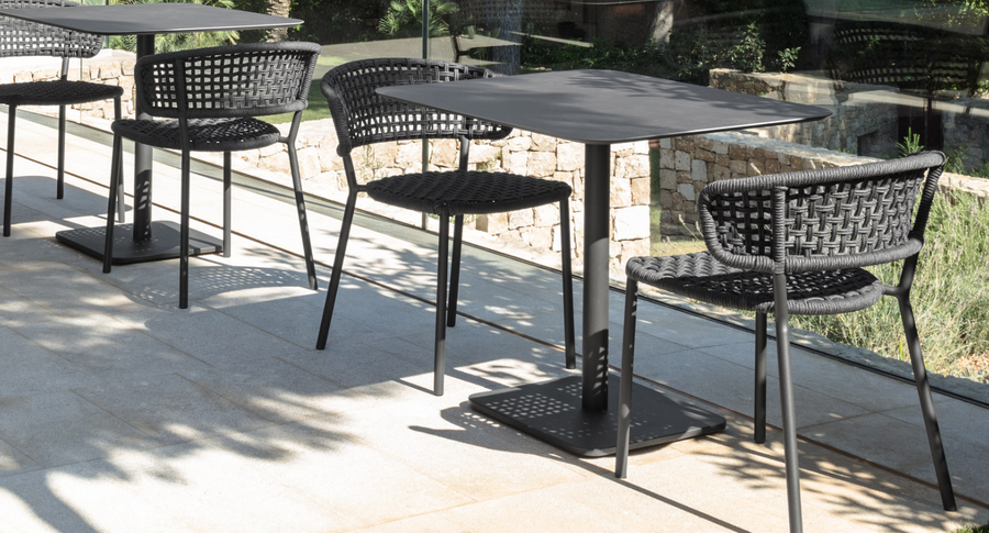 Moon side chair in graphite paired with Moon cafe table in graphite.