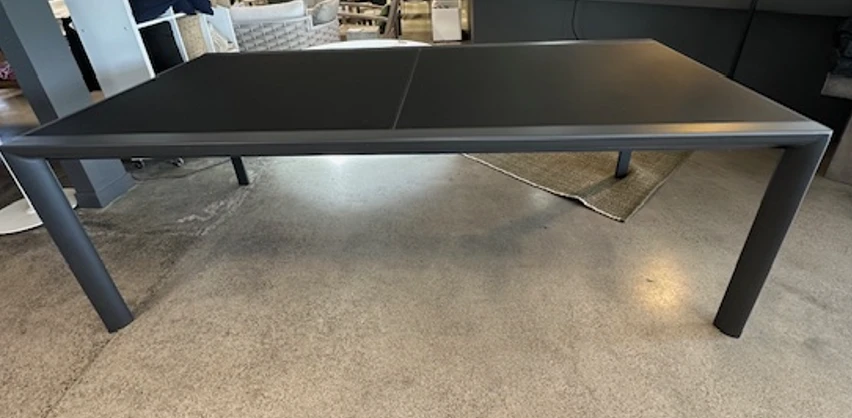 Themis table closed, fit three chairs along the side.