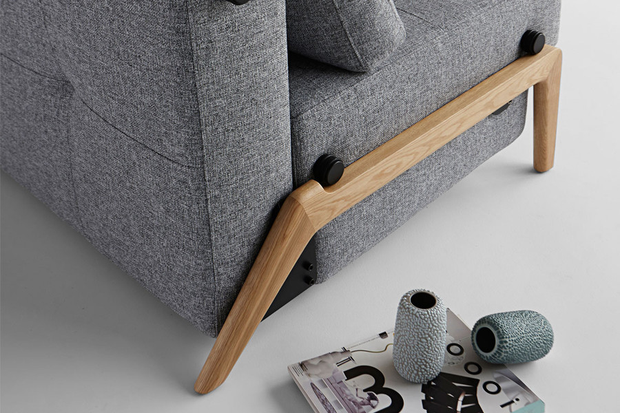 CUBED 160 sofa bed in the sofa position. Close up detail of the light oak wooden legs. Also available in Dark Oak legs