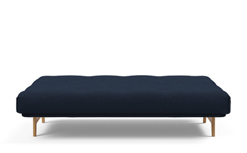 ASLAK sofa bed in bed position. Displayed here in Blue Dance. Please ask staff for fabric options