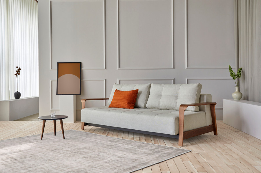 Displayed here as a sofa, the RAN Queen size sofa bed with dark walnut arms . Various fabric options are available.
Please ask our friendly staff for assistance when choosing fabric options .