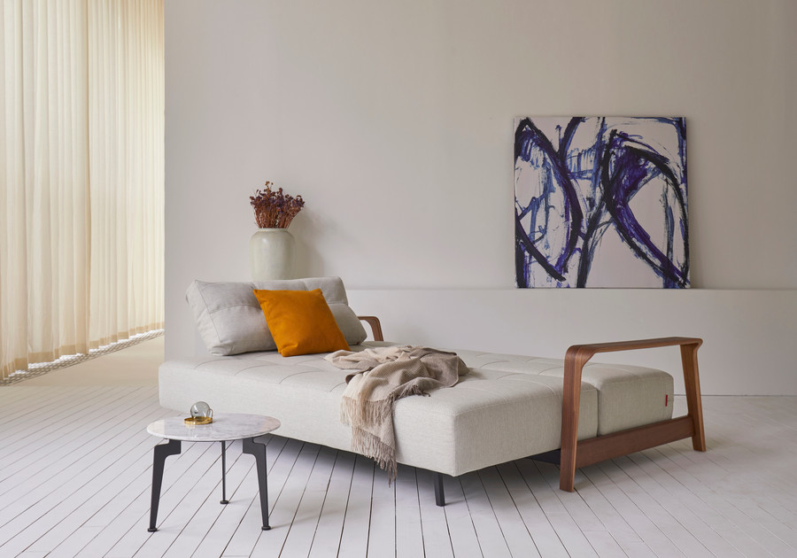 Displayed here as a bed, the RAN Queen size sofa bed with dark walnut arms . Various fabric options are available.
Please ask our friendly staff for assistance when choosing fabric options .