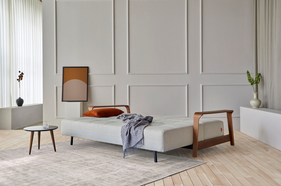 Displayed here as a bed, the RAN Queen size sofa bed with dark walnut arms . Various fabric options are available.
Please ask our friendly staff for assistance when choosing fabric options .