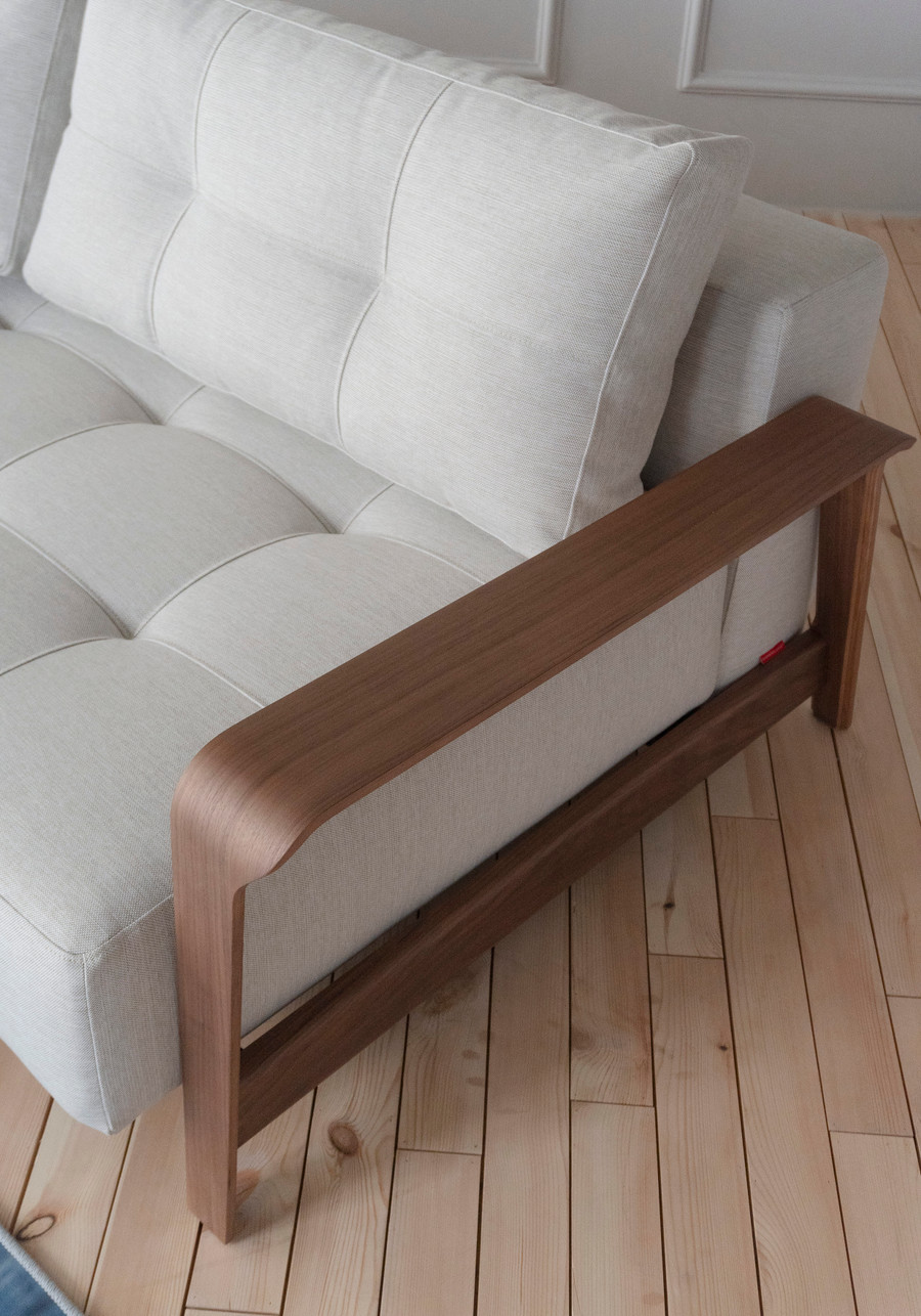 Displayed here as sofa, Close up view of RAN Queen size sofa bed with dark walnut arms. 
Please ask our friendly staff for assistance when choosing fabric options .
