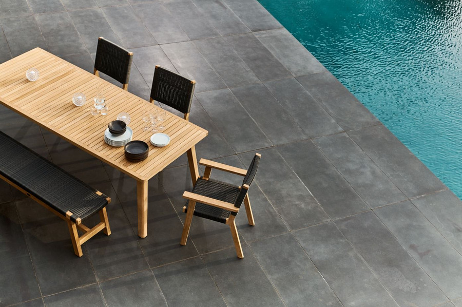 Another view of Devon JACKSON teak and wicker outdoor dining chair shown with Devon Porter outdoor table