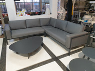 Reef outdoor corner sofa set in Charcoal with Natte Grey Sunbrella cushions. Picture also shows Leaf coffee table which is available separately.