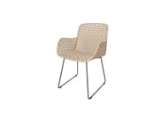 KAIA Dining Armchair - white shell ecolene wicker on a coal hot dipped galvanised steel frame with sleigh legs - angled view 
Also available in the matching KAIA dining side chair