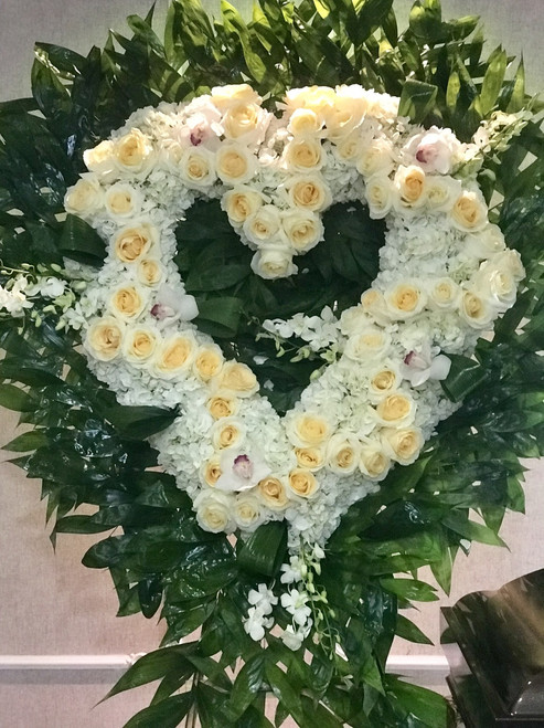 Roses and Hydrangeas with a touch of cymbidiums and dandrobiums. Colors can be substituted. 