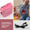 Picture of Byron Statics Portable Cassette Player in pink with picture of woman sitting down on floor,  picture of earphones and the words FM 88-103 MHz and AM550-1700 KHz Help get a better reception with earphones.