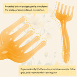 Five rounded prongs and the palm-fitting handle of the Gen'C Béauty Hand-Shaped Scalp Massage Brush