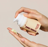 Hand demonstrating the smooth texture of K-Secret Seoul 1988 Retinal Renewal Cream