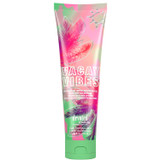 Front view of Bath and Body Works Vacay Vibes body lotion tube with pink floral and palm tree design.
