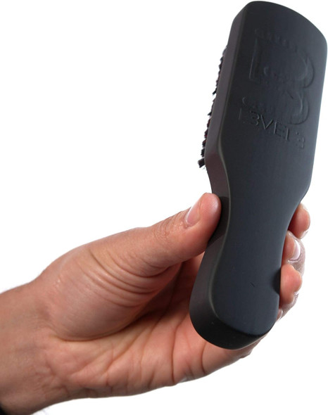 L3VEL3 brush in hand, ideal for grooming beards and mustaches.