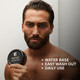 Man holding Elegance Hair Pomade for professional barber-grade styling