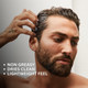 Male model styling slick back hair with Elegance Transparent Hair Pomade