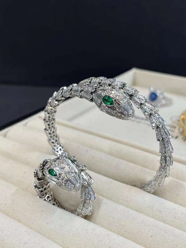 Platinum Serpenti Ring Set with Emerald Eyes and Full Pavé Moissanite rings Chez Judy Platinum Serpenti Ring Set with Emerald Eyes and Full Pavé Moissanite rings Chez Judy