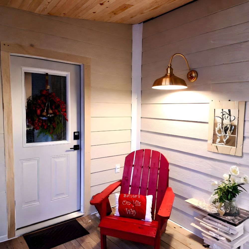 Raw Copper Gooseneck Light Over White Door