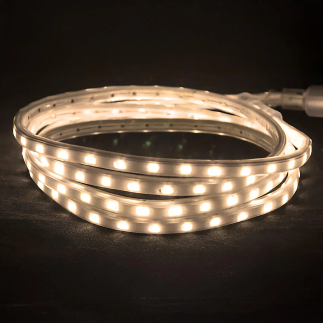 Warm white 120V hybrid LED tape light glowing in a coil