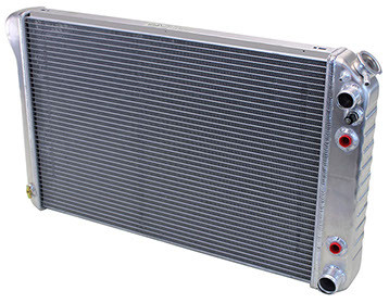 We now offer conversion radiators specifically designed for your car with an LS engine. They feature all aluminum construction, but unlike others on the market, they have beautifully stamped tanks with strengthening indentations just like your original. They're a double pass design putting the inlet and outlet on the same side which greatly simplifies plumbing to the engine. The all important steam port bung is welded into the upper part of the tank which lets your new LS engine vent properly. They also include a coolant temp fan switch in the tank as well as a billet radiator cap. Excellent restoration type quality made in the USA. Available in bare aluminum or black.