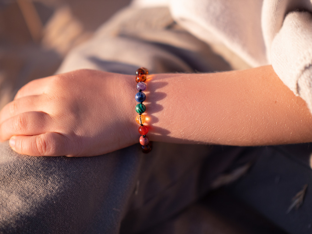 Chakra beads Baltic amber teething bracelet or anklet for children – handcrafted jewellery available in the UK & Ireland 