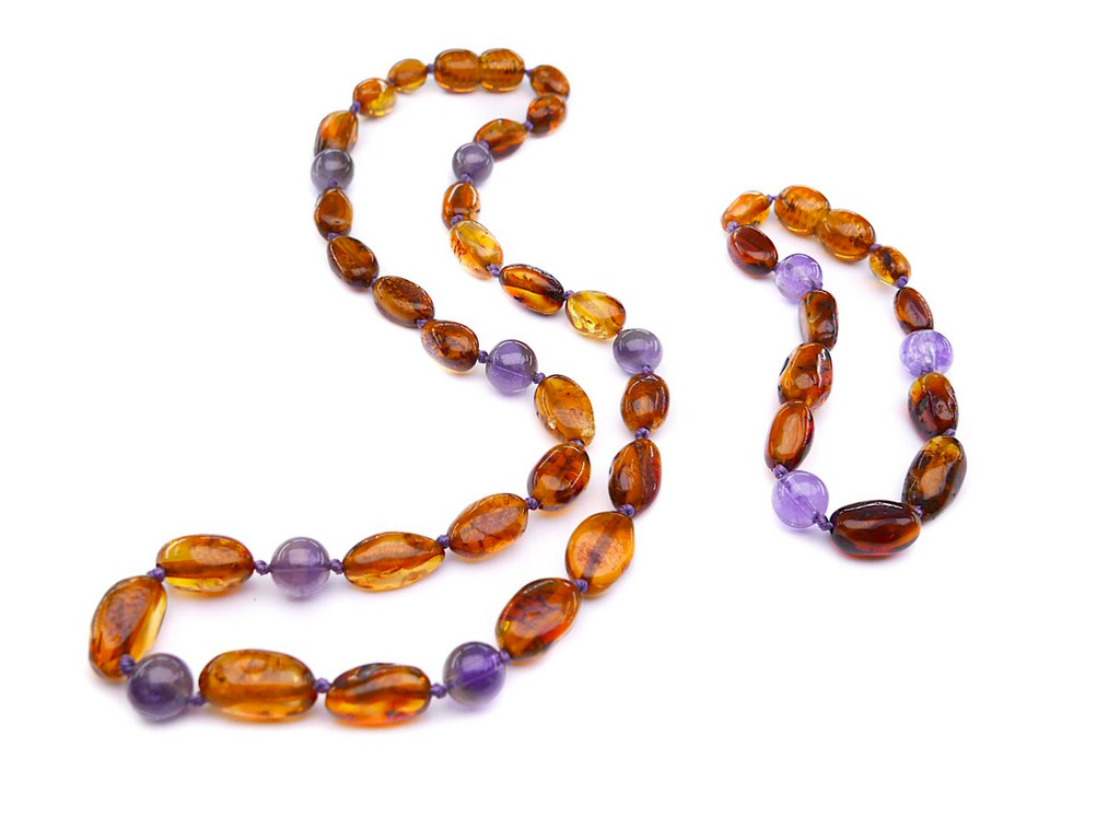 Amber teething set with amethyst. Genuine amber beads
