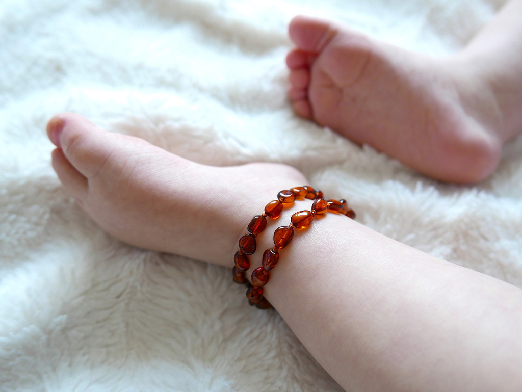 Handcrafted cognac amber teething necklace for children made from polished Baltic beads