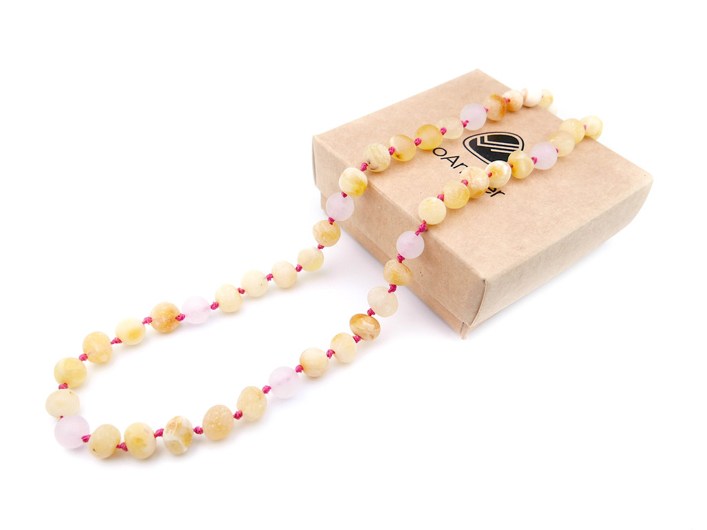 Raw butterscotch Baltic amber teething necklace with unpolished nugget beads and matte rose quartz accents 